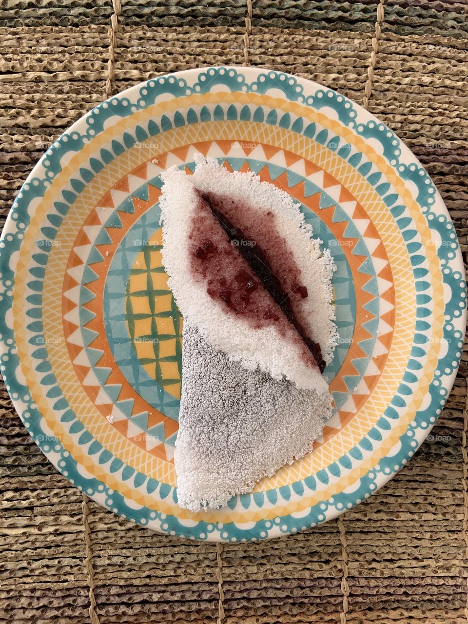 Tapioca with blueberry jam . Tapioca is typical Brazilian snack gluten-free