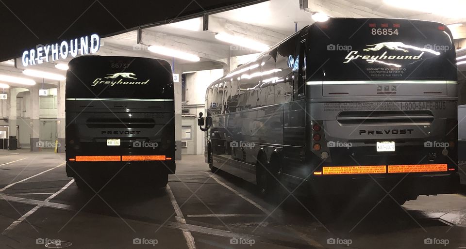 The loading dock at Oakland’s Greyhound station on San Pablo ave around midnight. All busses are preparing for departure so they’re all running in this shot.