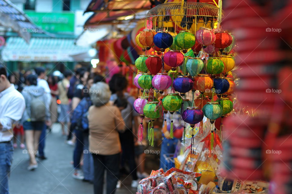Lanterns toys for Mid-autumn festival on evening, selling in front of shops in Vietnam market