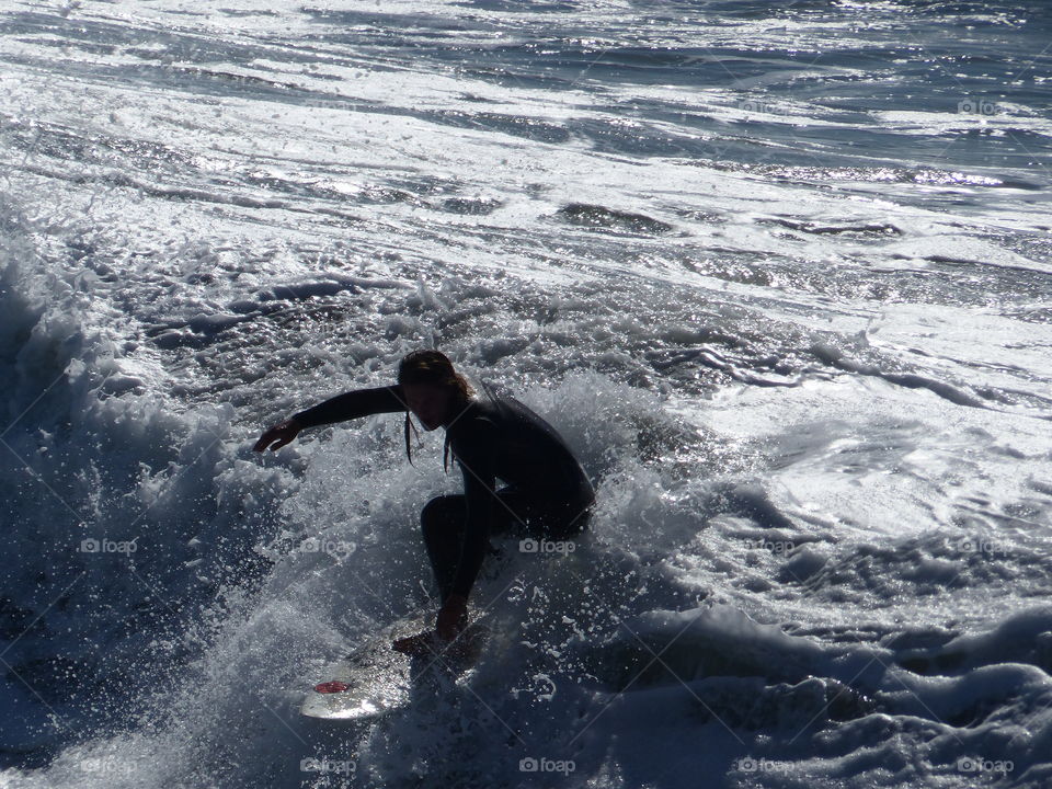 Surfer finishing the ride 