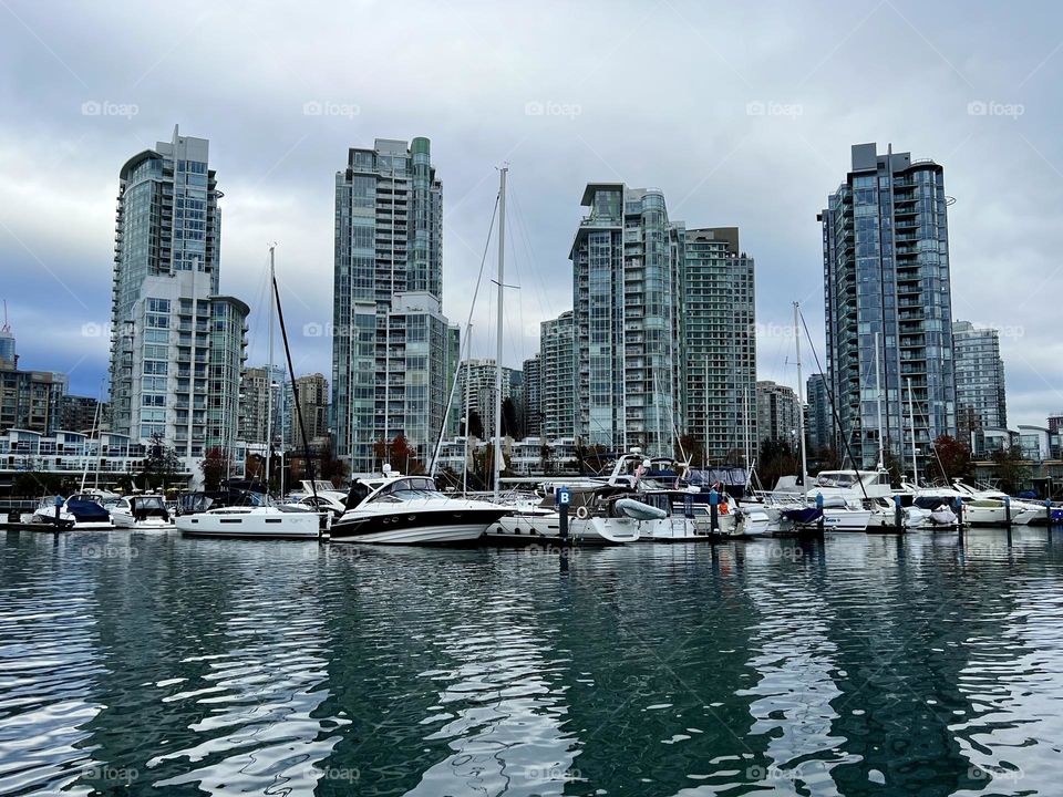 Walking down a dock looking out at False Creek Harbour in Downtown Vancouver