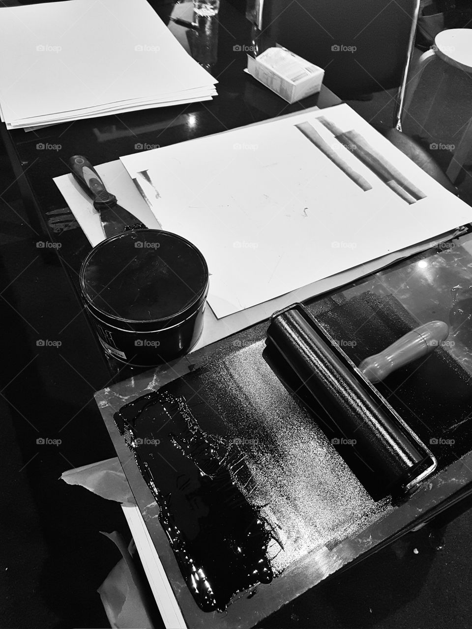 artists tools black paint blank white paper at workshop