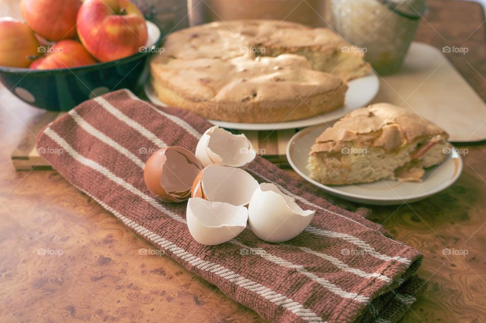 Making homemade puffed apple pie with eggs, sugar and flour.