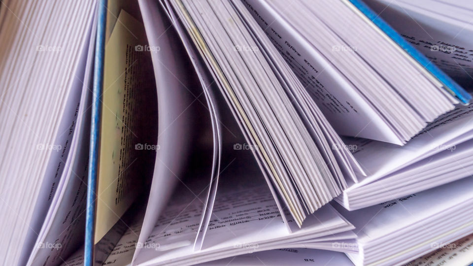 Many Hardcover Old books on grunge wooden table desk shelf in library on isolated background. Hardback no labels. Education reading concept. Back to school ideas Top view with copy space room for text