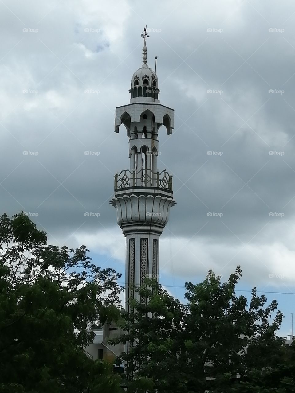 Let's get abstract. Mosque minar in front of the clouds.