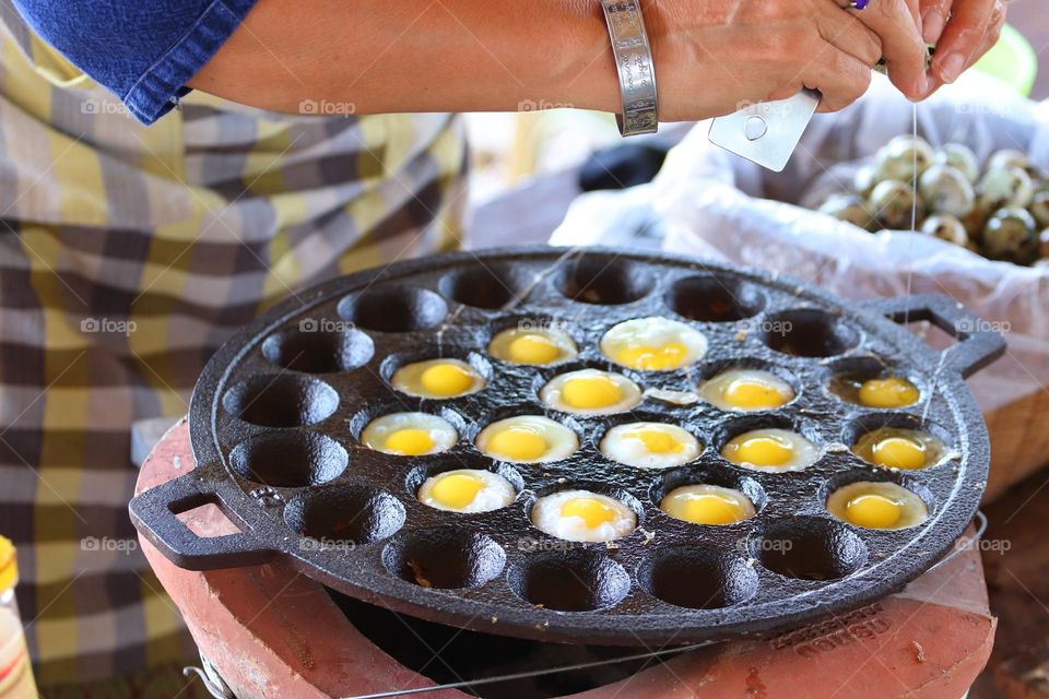 Making scrambled egg for children to eat.