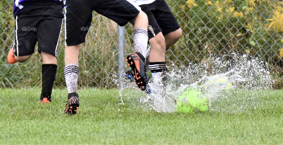 Playing soccer in the rain