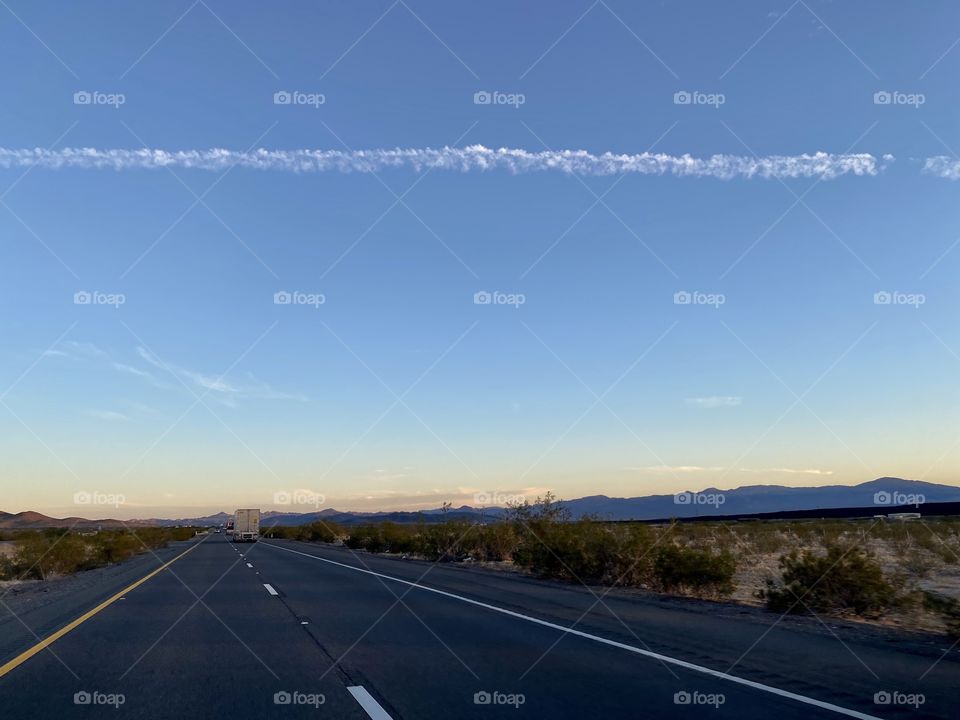 Sunset driving on Interstate 40 highway through Newberry Springs California 