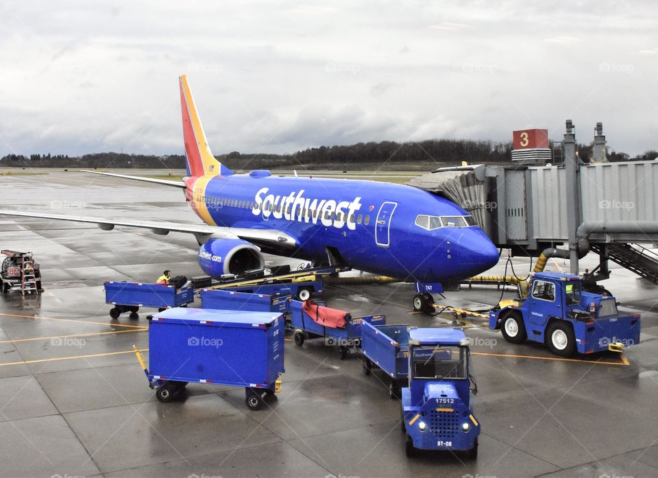 Southwest Airline Terminal, at Pittsburgh International Airport, jet preparing for flight, getting luggage into plane