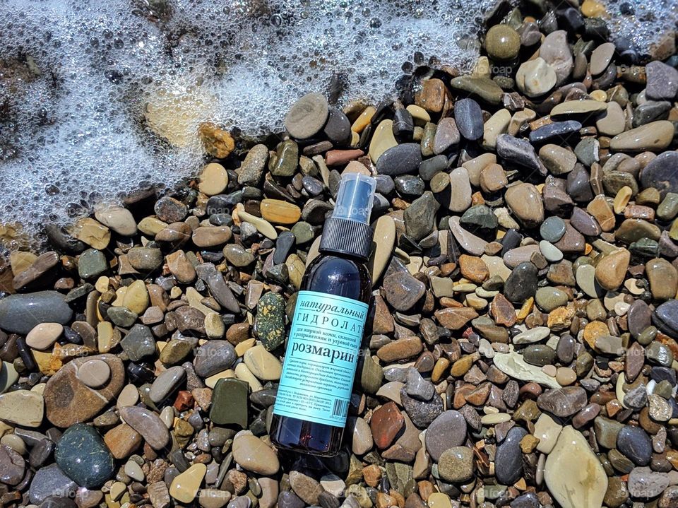 cosmetics on the sea stone beach