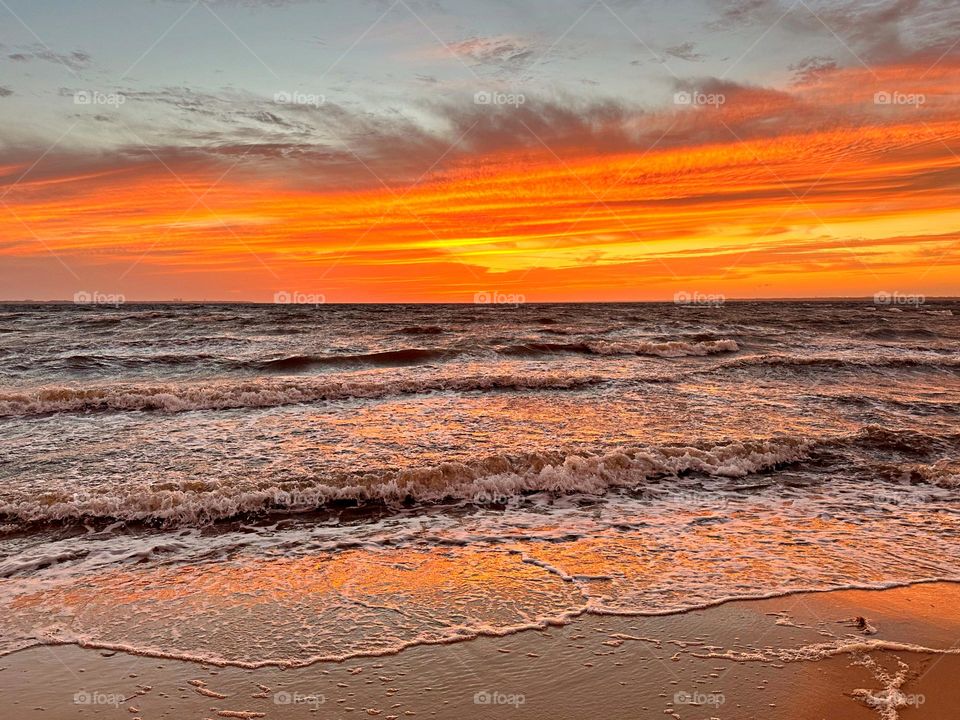 Magic of the Sunset - The radiance of the beautIful orange colored sky from the framed descending sunset as it was glorious to behold and increasing every moment in splendor. Pine tree silhouettes stand tall