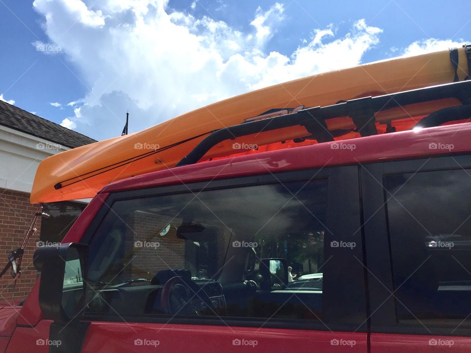 Red keep with a yellow kayak or canoe 