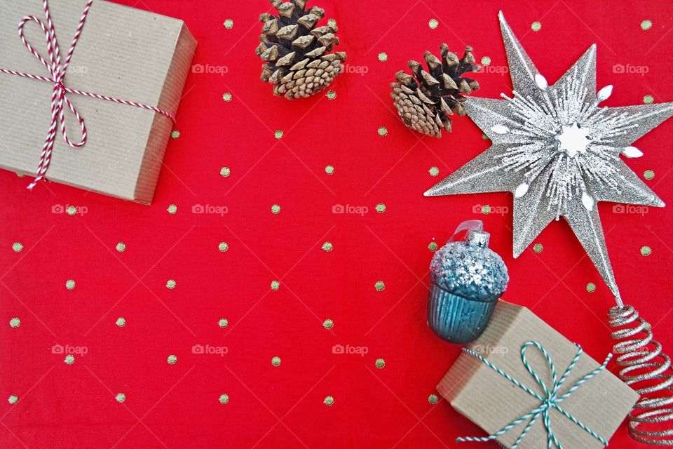 Red polka dots table cloth with Christmas presents , chocolates and decor 