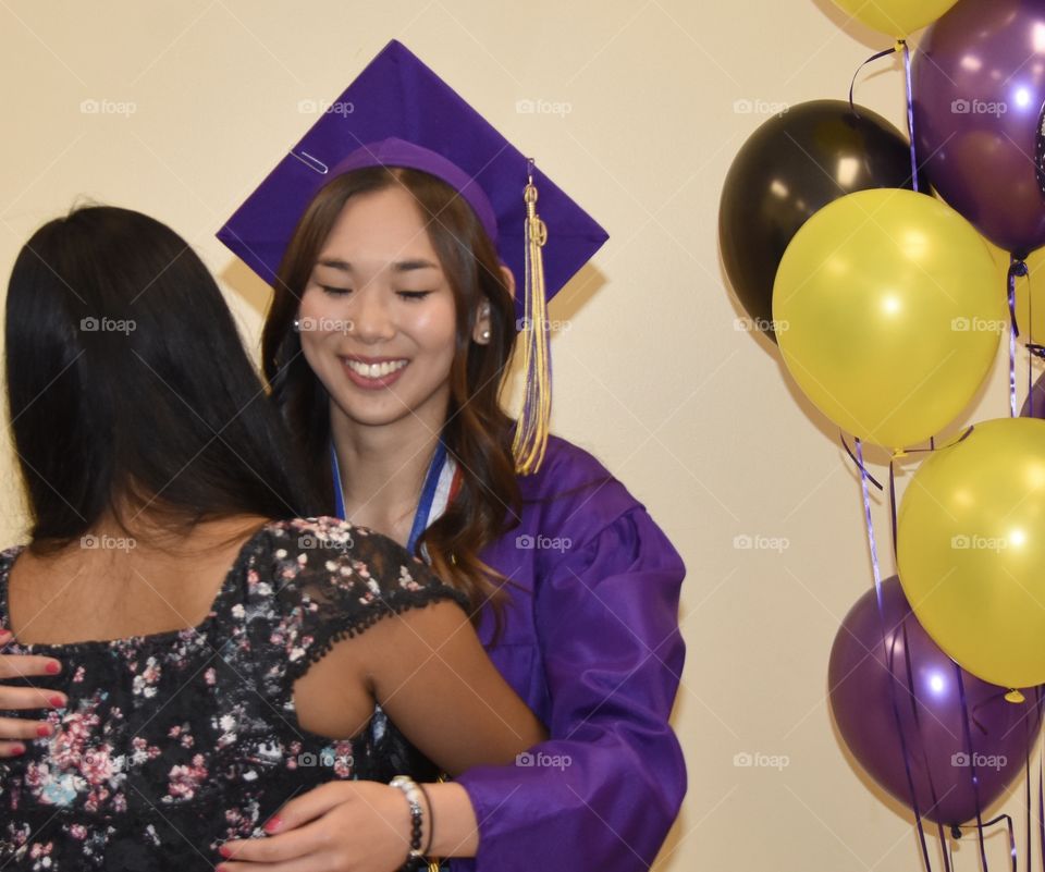 A graduation hug