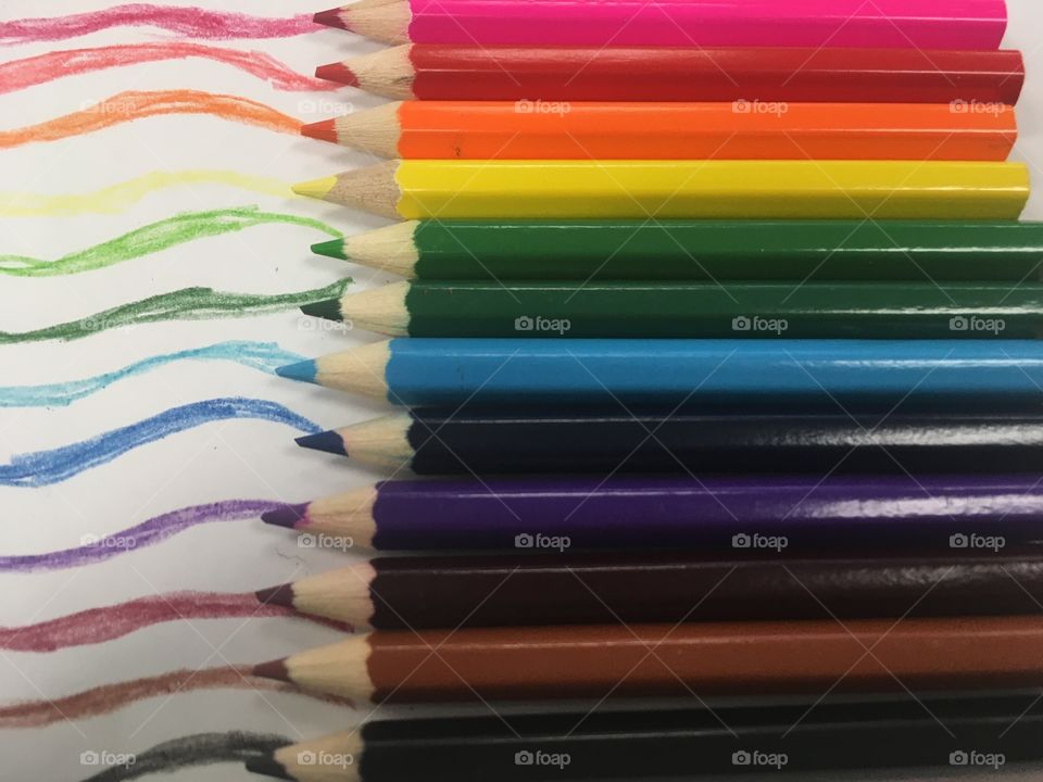 Colored pencils with drawn lines 