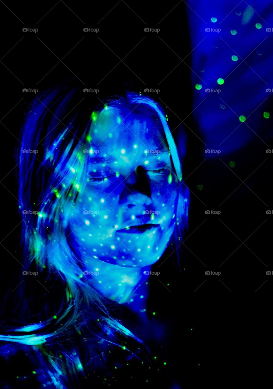 Girl lighted with galaxy-light, blue