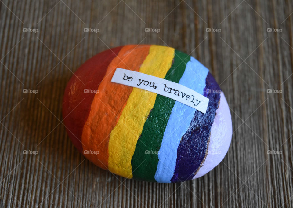 Rock painted with inspirational sentiment