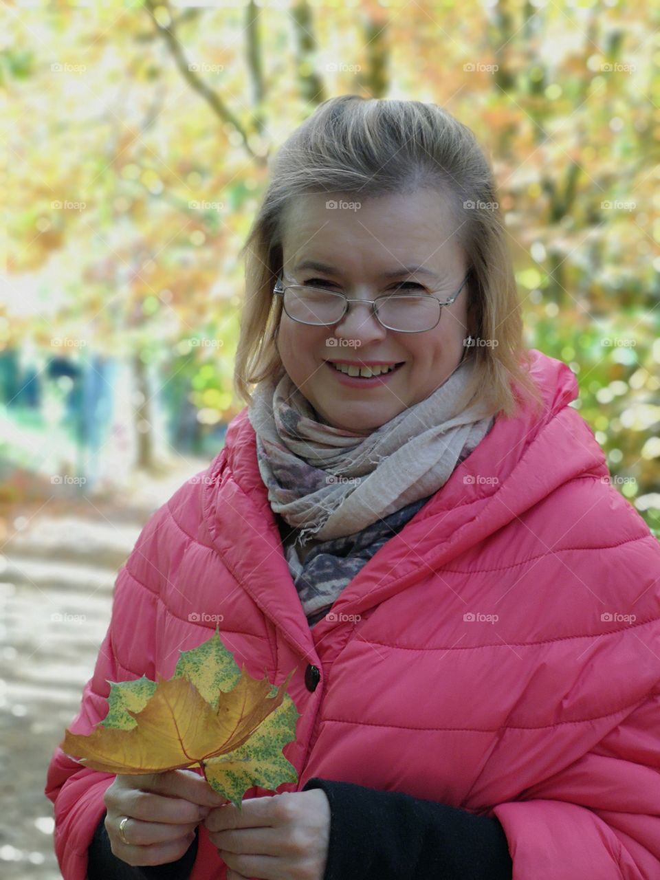 The charming girl in the autumn forest