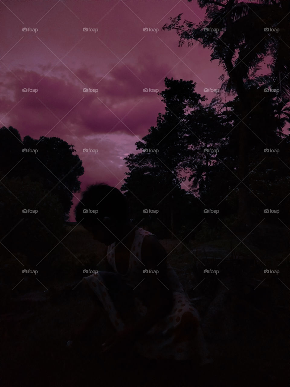 Kid playing under the sky...an evening scene