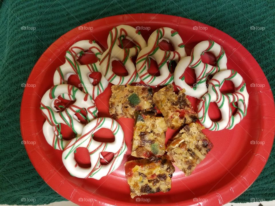 moist and delicious Fruit cake and white chocolate covered large pretzels