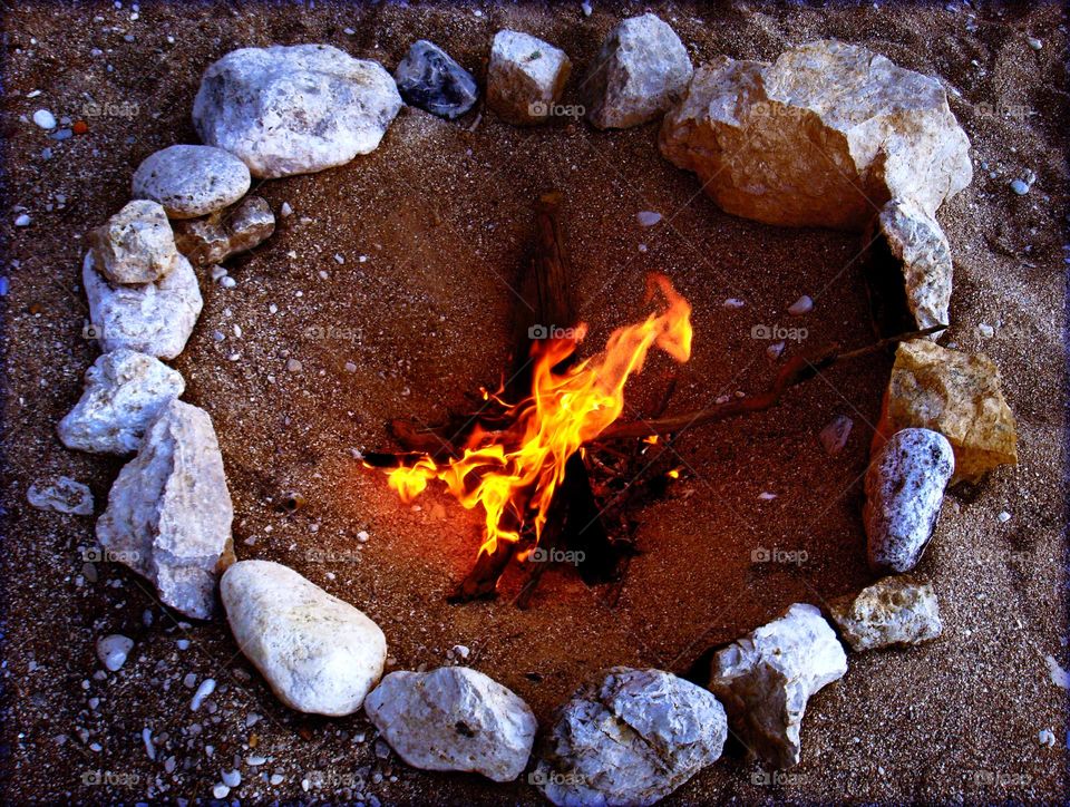 Fire between rocks on the beach summer holidays Crete Island Greece seascape chill out naturalism crystal waters paradise bay traveling with friends