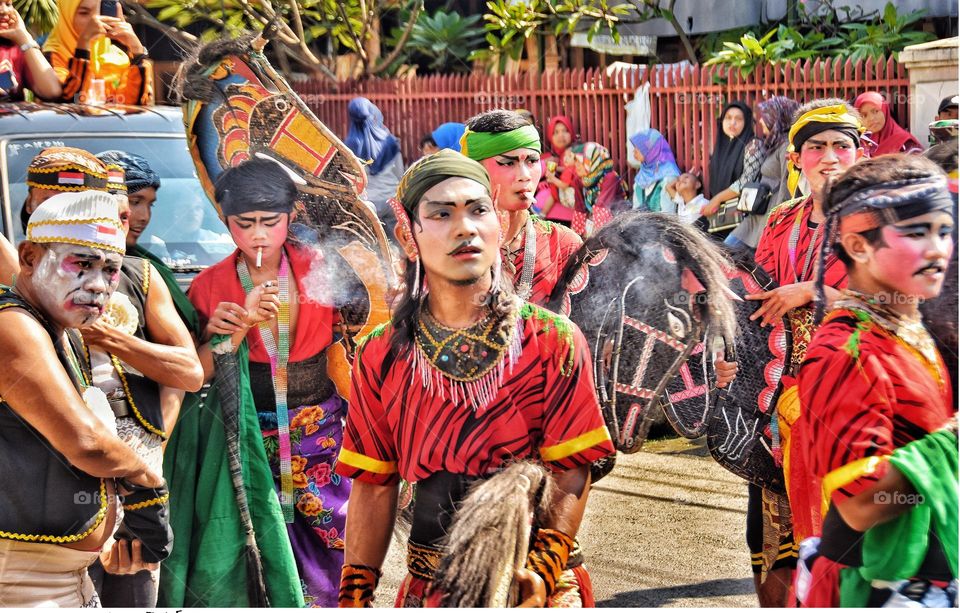 mask dancers is ready to perform a traditional dance called "kuda lumping dance"