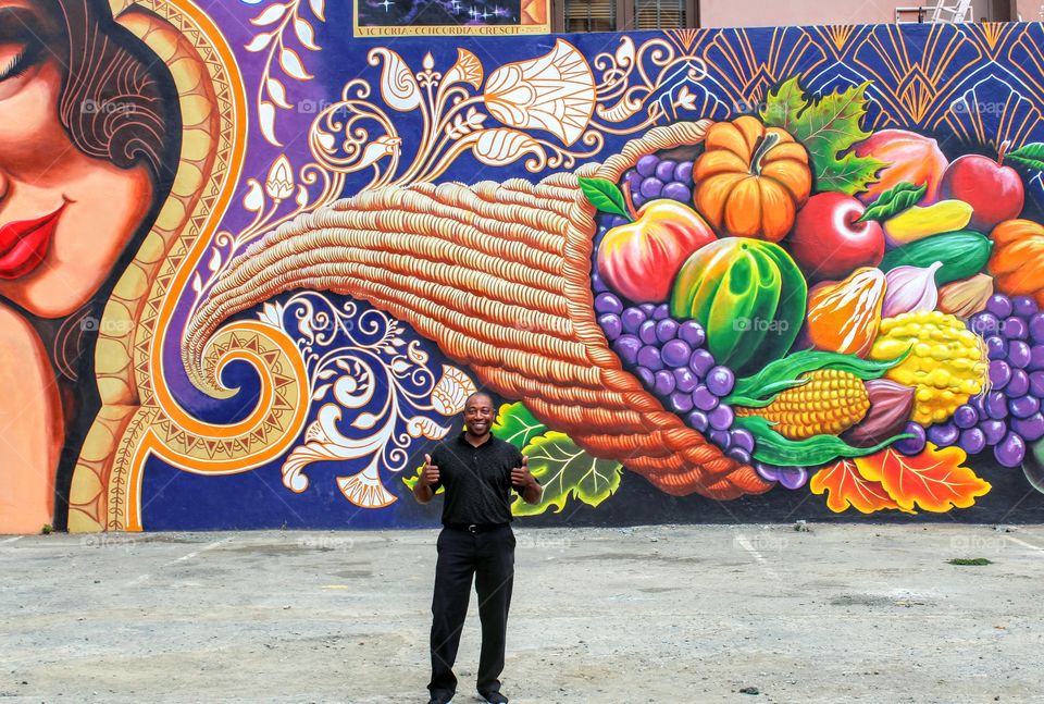 two thumbs up wall painting