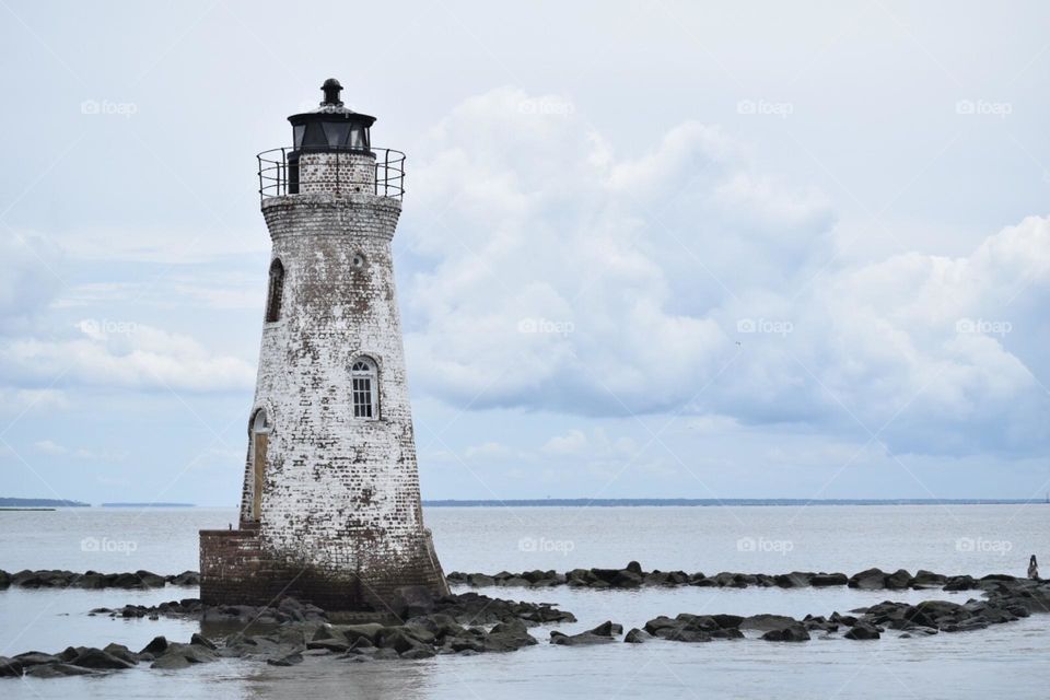 A rustic white lighthouse of the coast of Savannah Georgia 