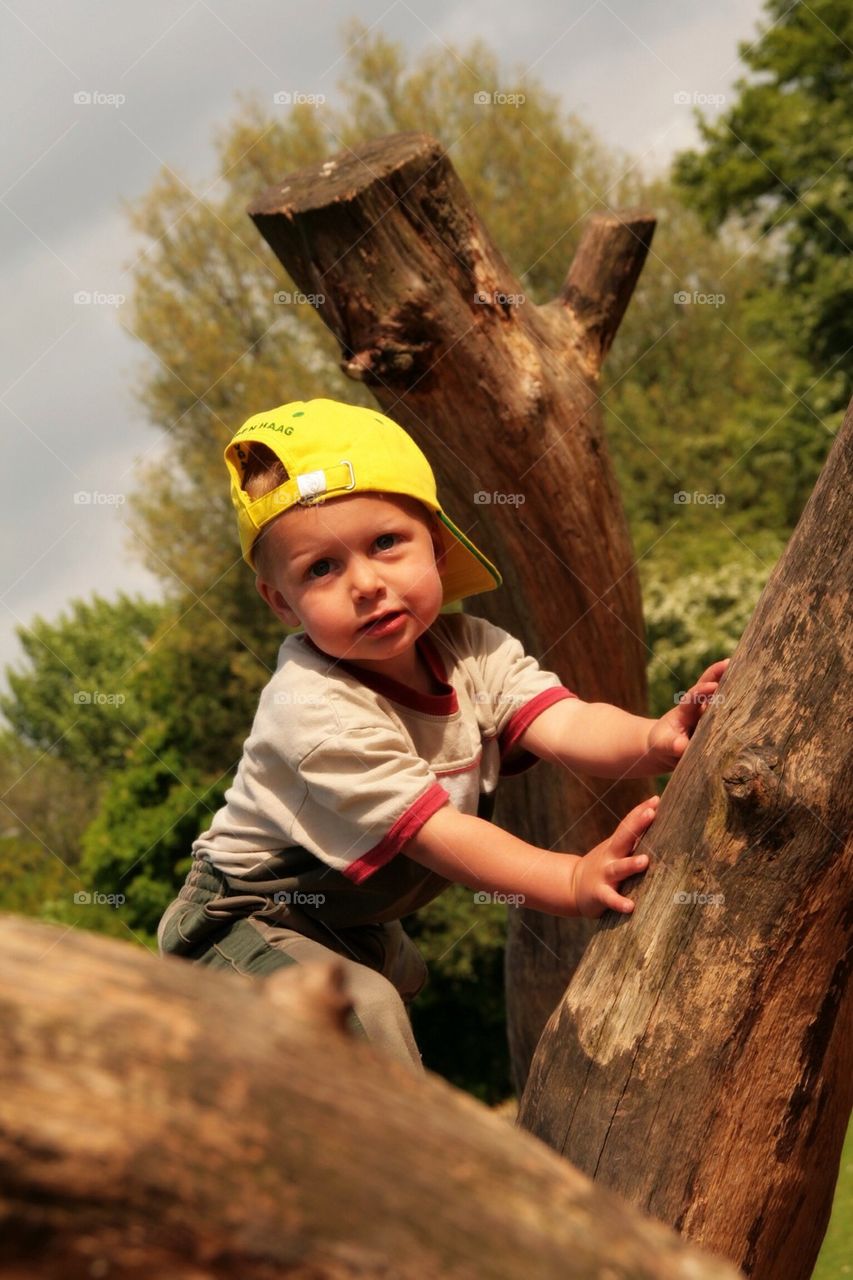 Little boy Playing in the Forrest