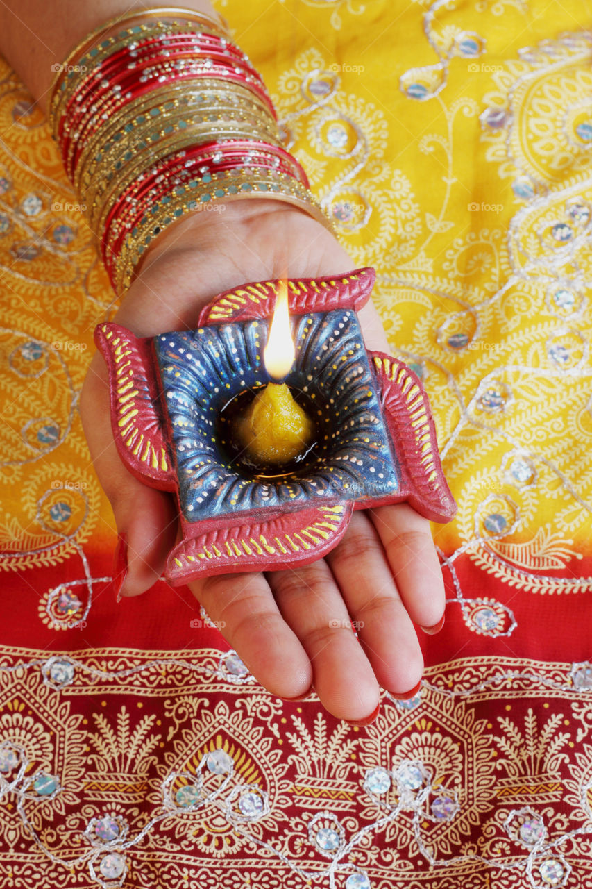 Diwali diya in a female hand