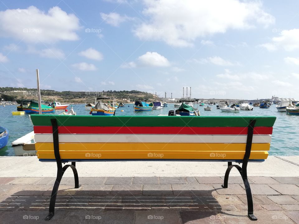 Typical colored bench by Marsaxlokk (Malta)