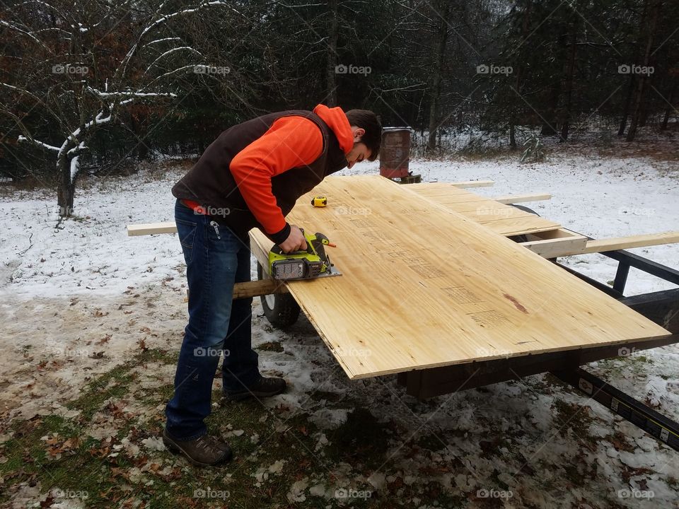 building doors to the shed to keep the snow out