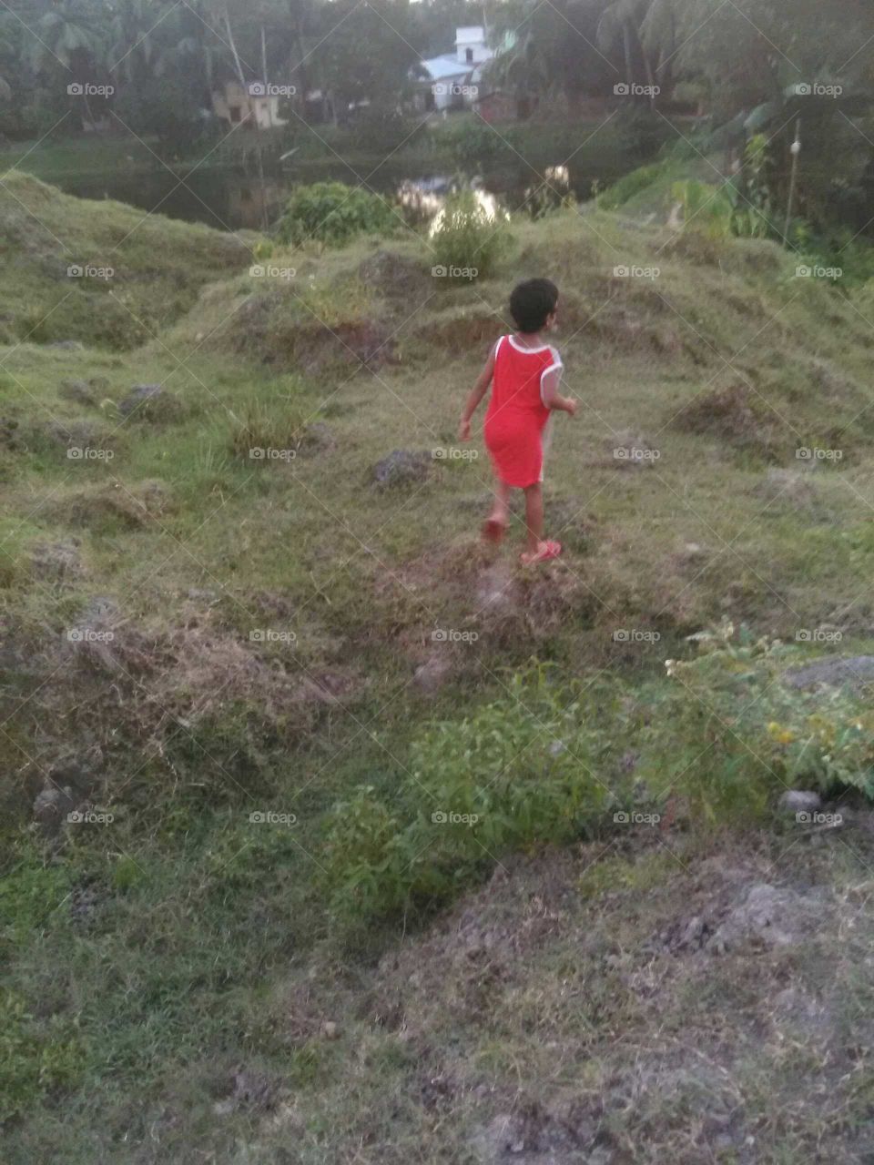 baby running at hill
