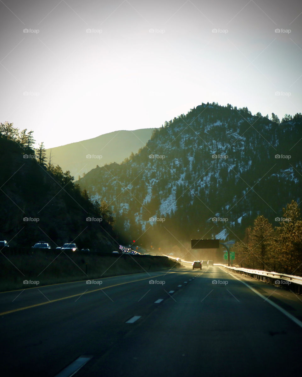 Traveling through the mountain pass into the sunlight.