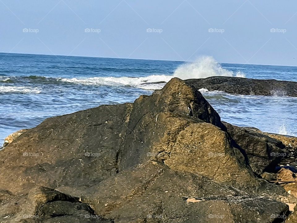 A rock reef beside the sea in the beautiful morning