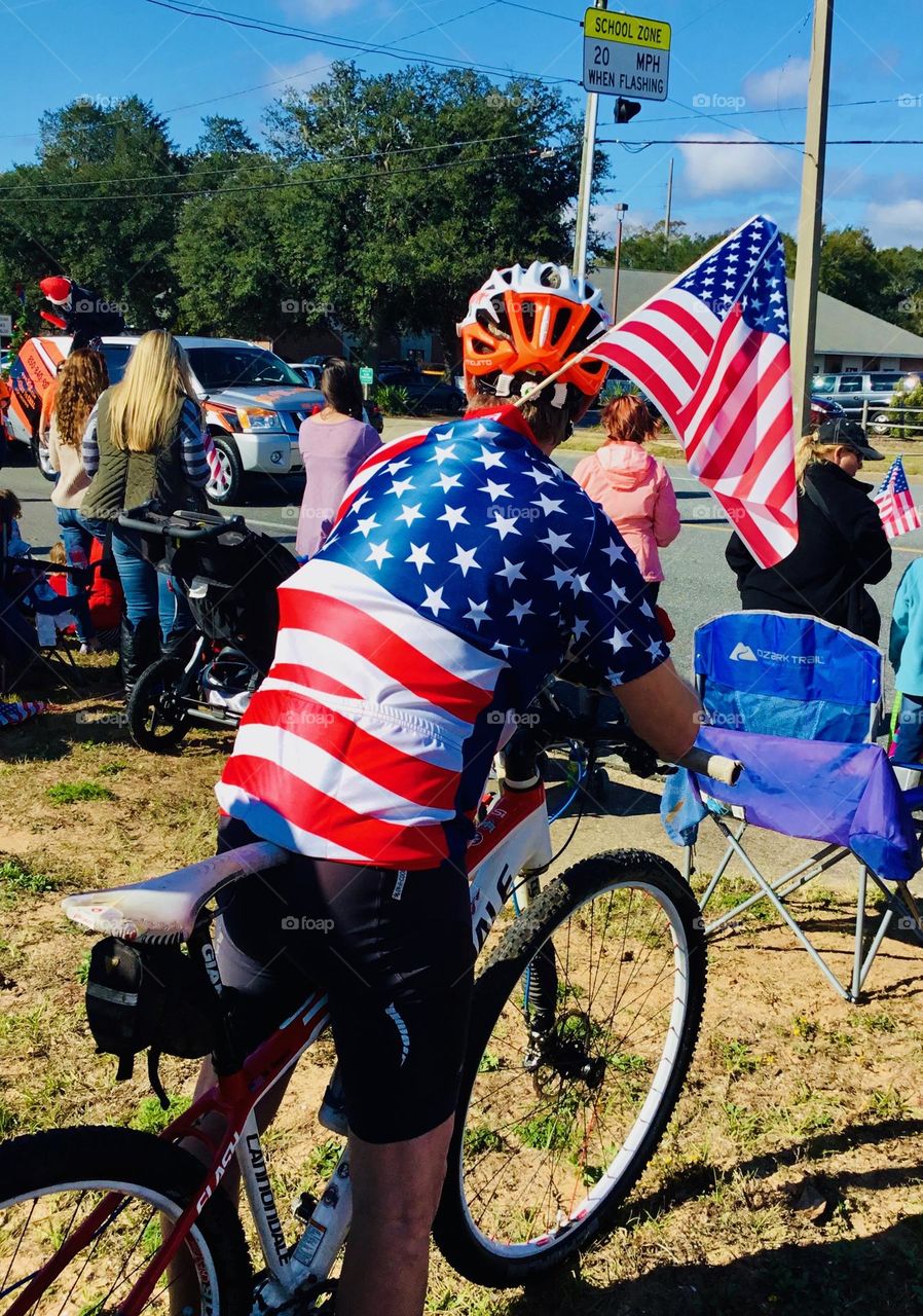 Patriotism on a street bike -  Scooters and Bicycles on city streets. The law allows people to operate bicycles with electric assist (e-bikes) on some streets and highways