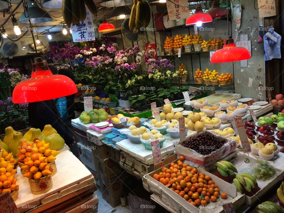 Fruits and flowers . Typical vibrant shop front and stalls in Hong Kong 