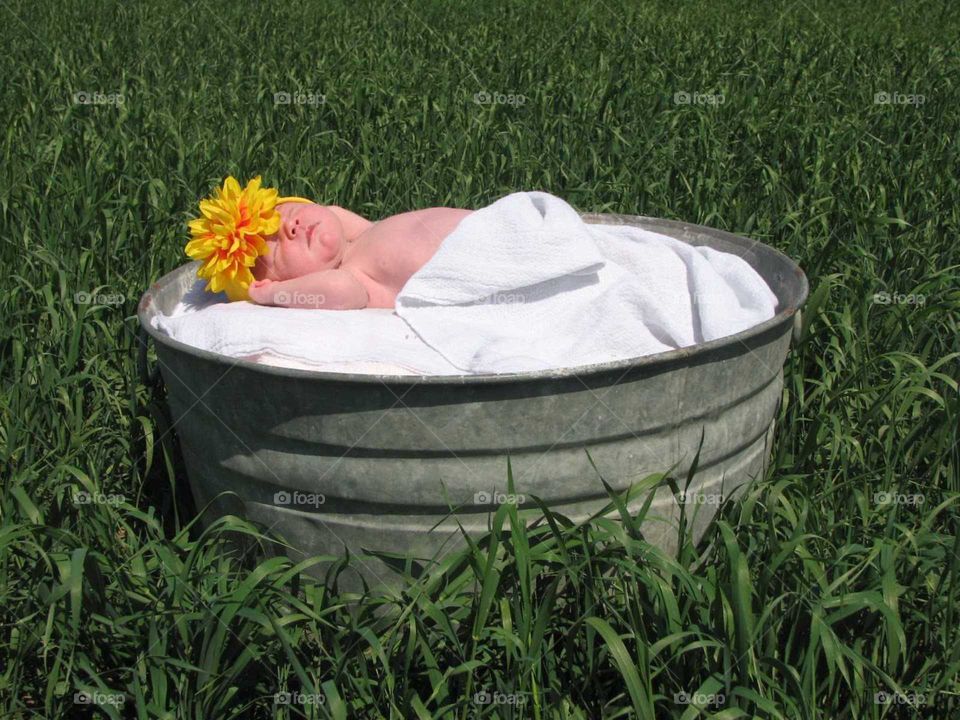 washtub baby in hay field