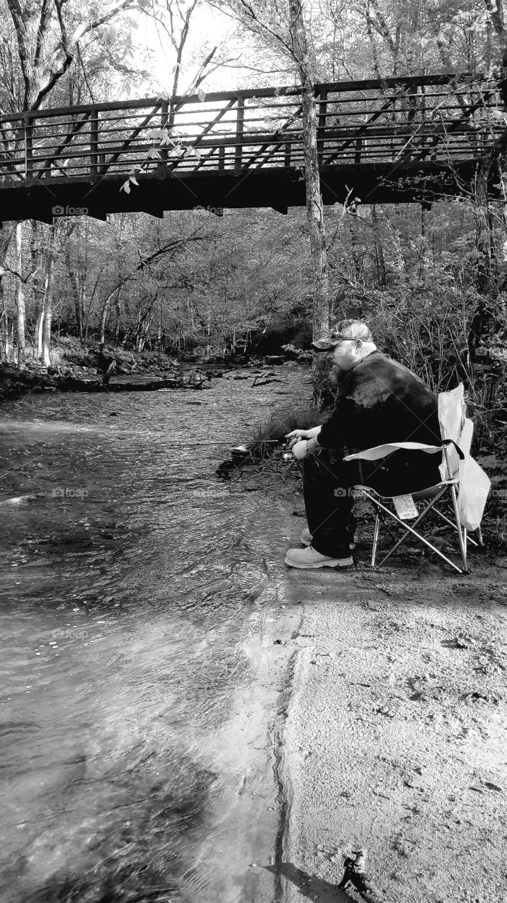 man fishing Minnesota river