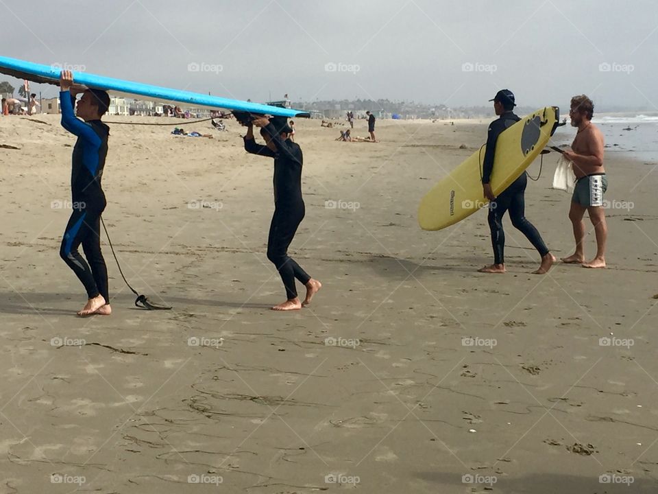 Coming in from the water after catching some waves