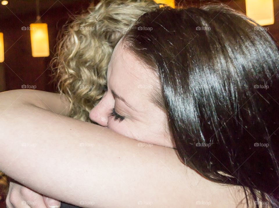 Tearful daughter making the choice to leave home, the moment of goodbyes 