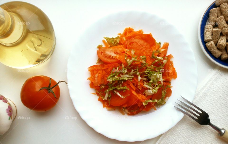 Fresh salad with tomatoes and carrot