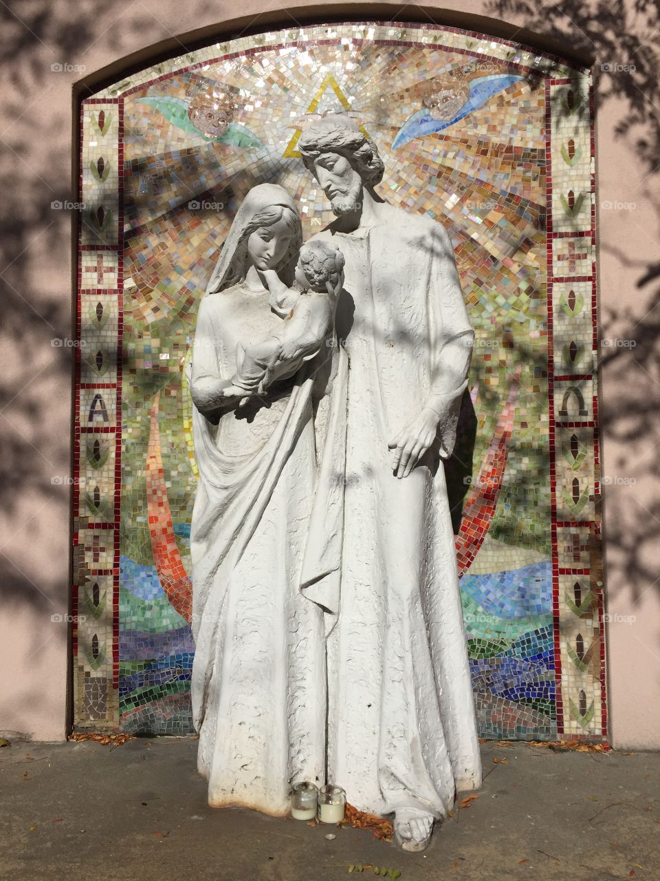 Statutes of Mary Jospeh and baby Jesus under the Holy Spirit. 