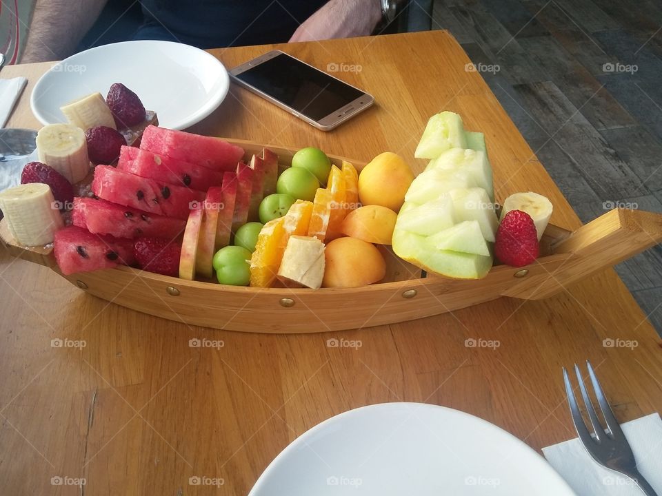 Mixed fruit dish in a Turkish restaurant in the form of a boat