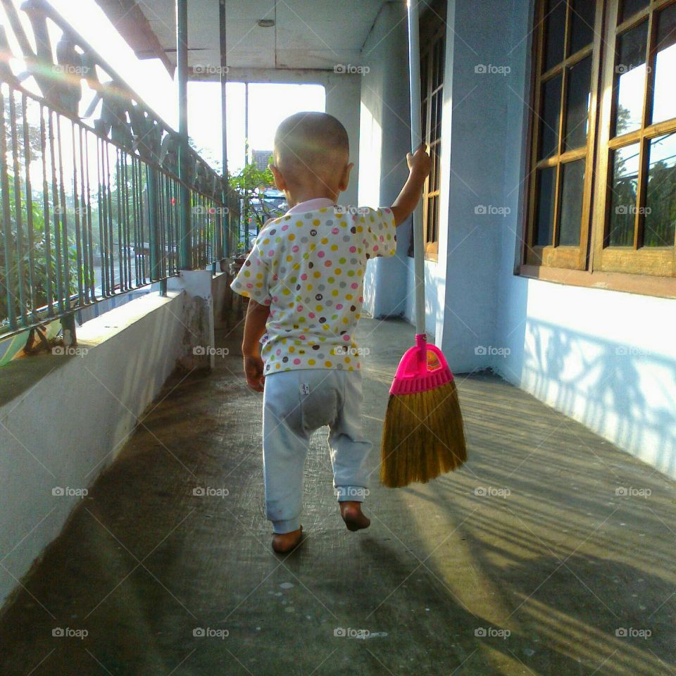a child who helped his mother clean the attic of the house in the morning