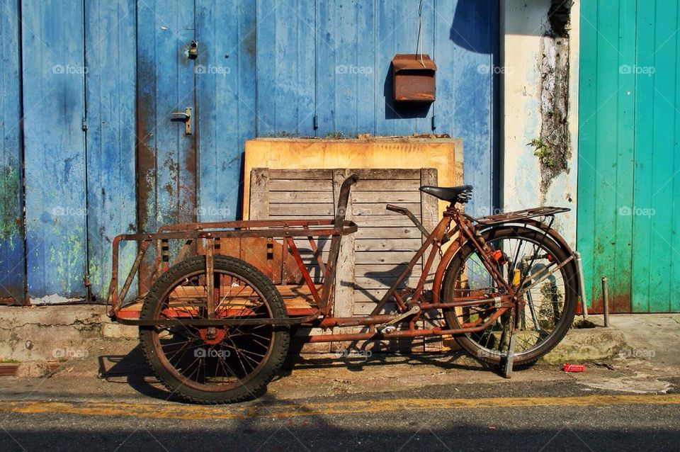 An old rusty tricycle