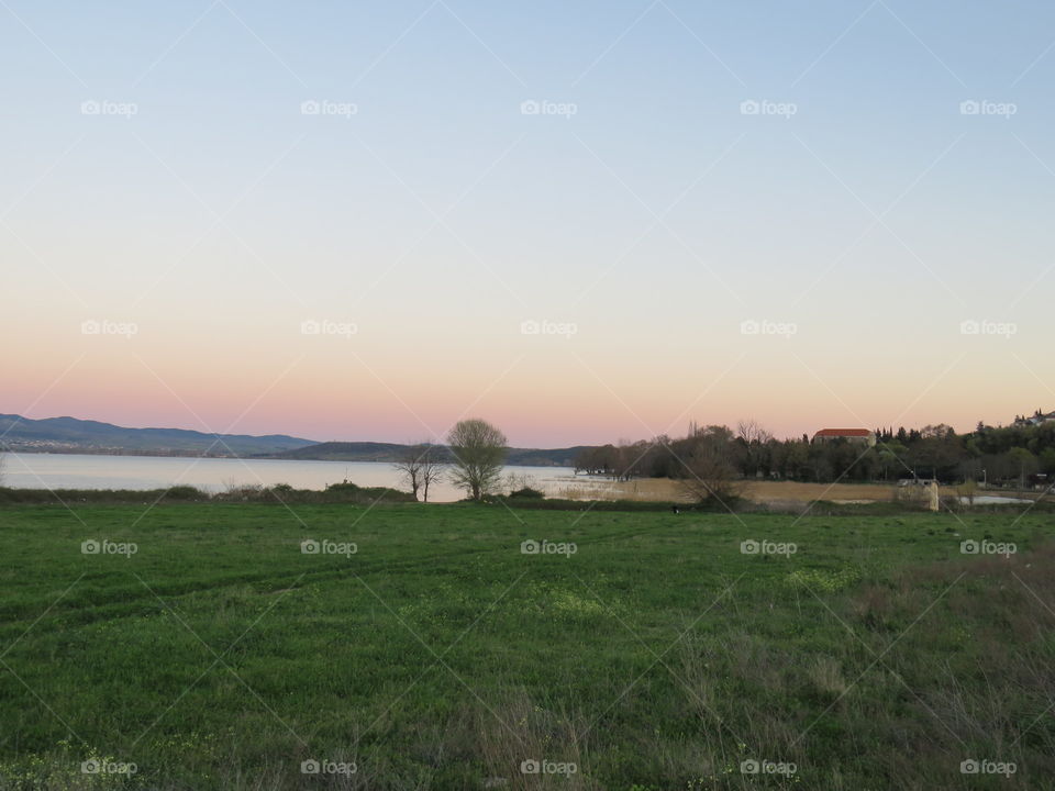 Green pasture on the River shore