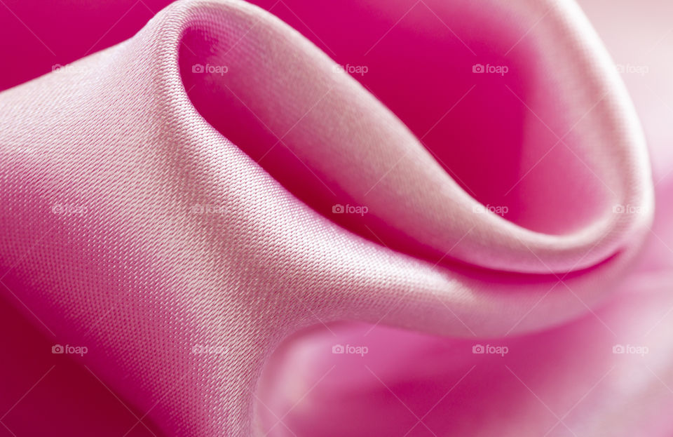 Satin Luxury Cloth Texture Can Use As Abstract Holidays. Abstract design background. Smooth Elegant Shiny Pink Silk
