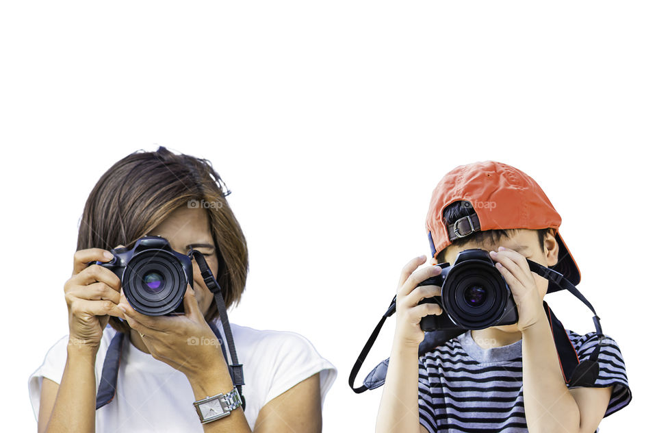 Hand woman and boy holding the camera Taking pictures on a white background.