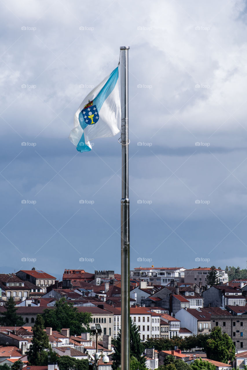 View of Galician flag and Santiago de Compostela